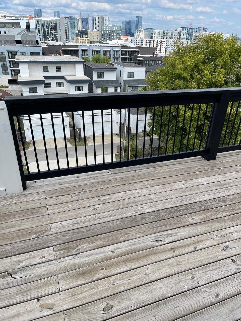 Black metal deck railing with Nashville skyline
