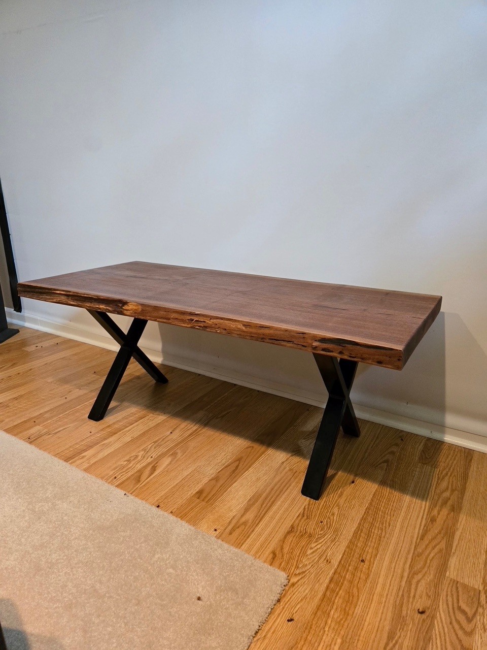 Live edge wood table with custom welded X-legs
